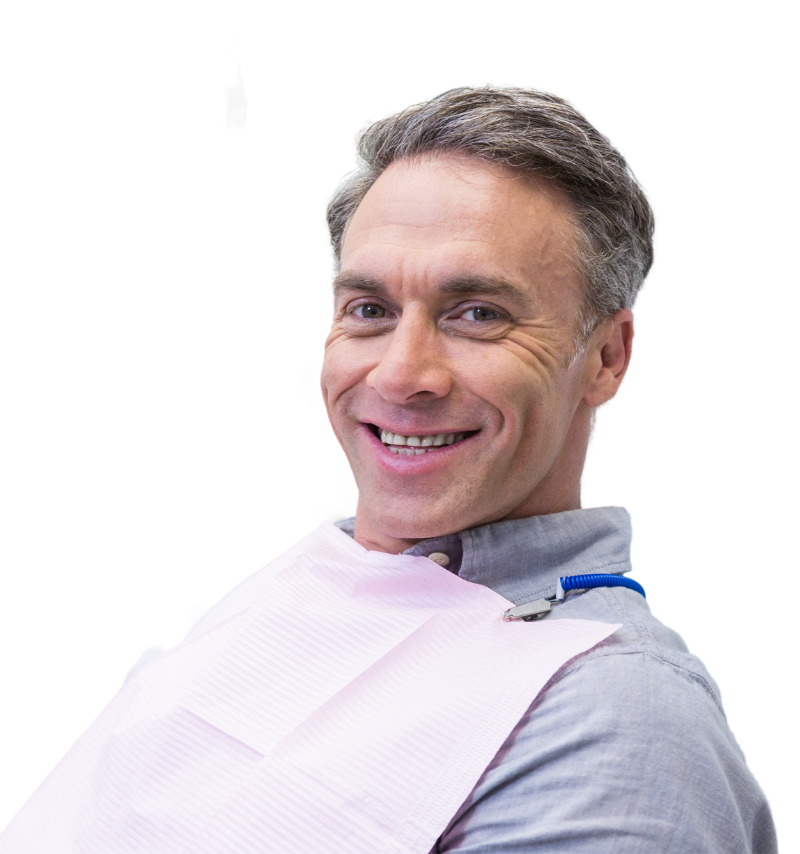 Older man getting ready for an oral screening and smiling.